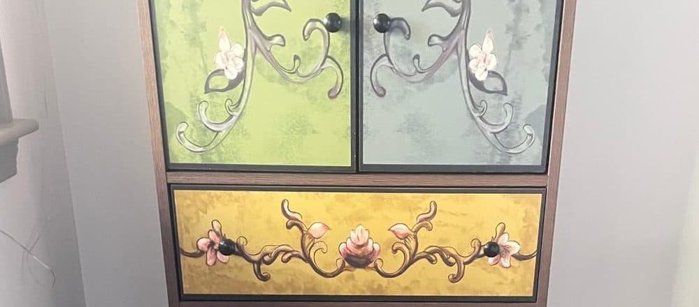 Hand-painted floral cabinet assembled and placed in a Boston home