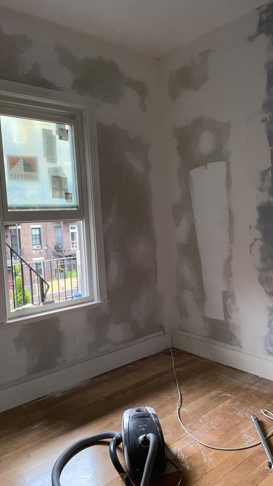 Walls patched and prepped for painting in a Boston apartment