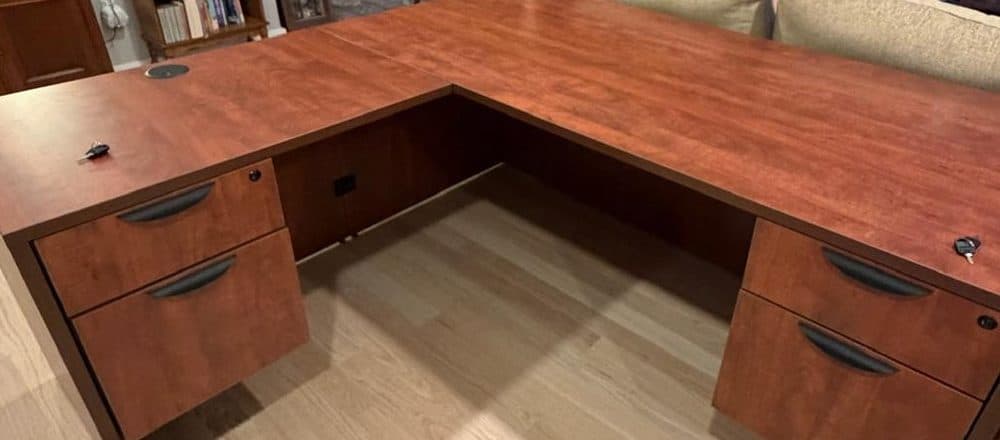 L-shaped office desk assembled in a Boston home office