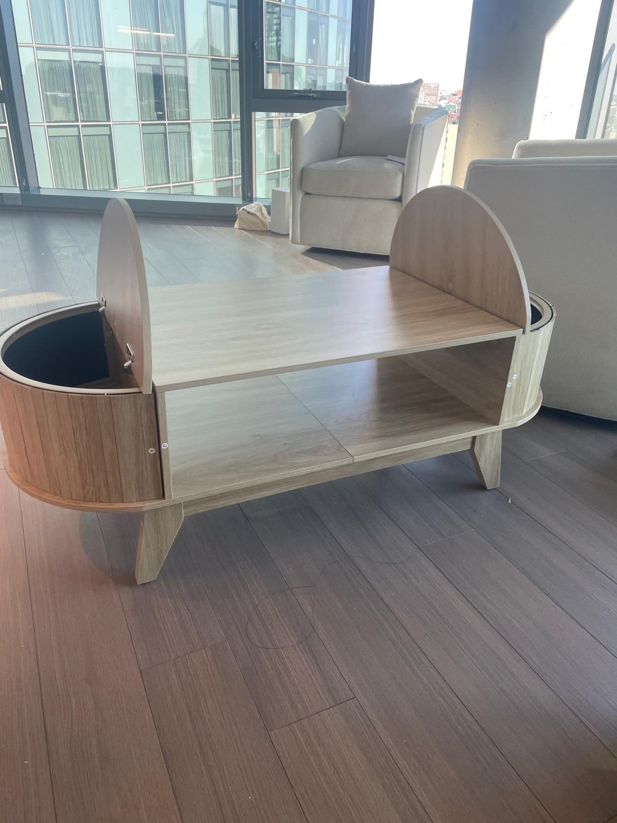 Curved wood media console and shelving unit assembled in a Boston living room