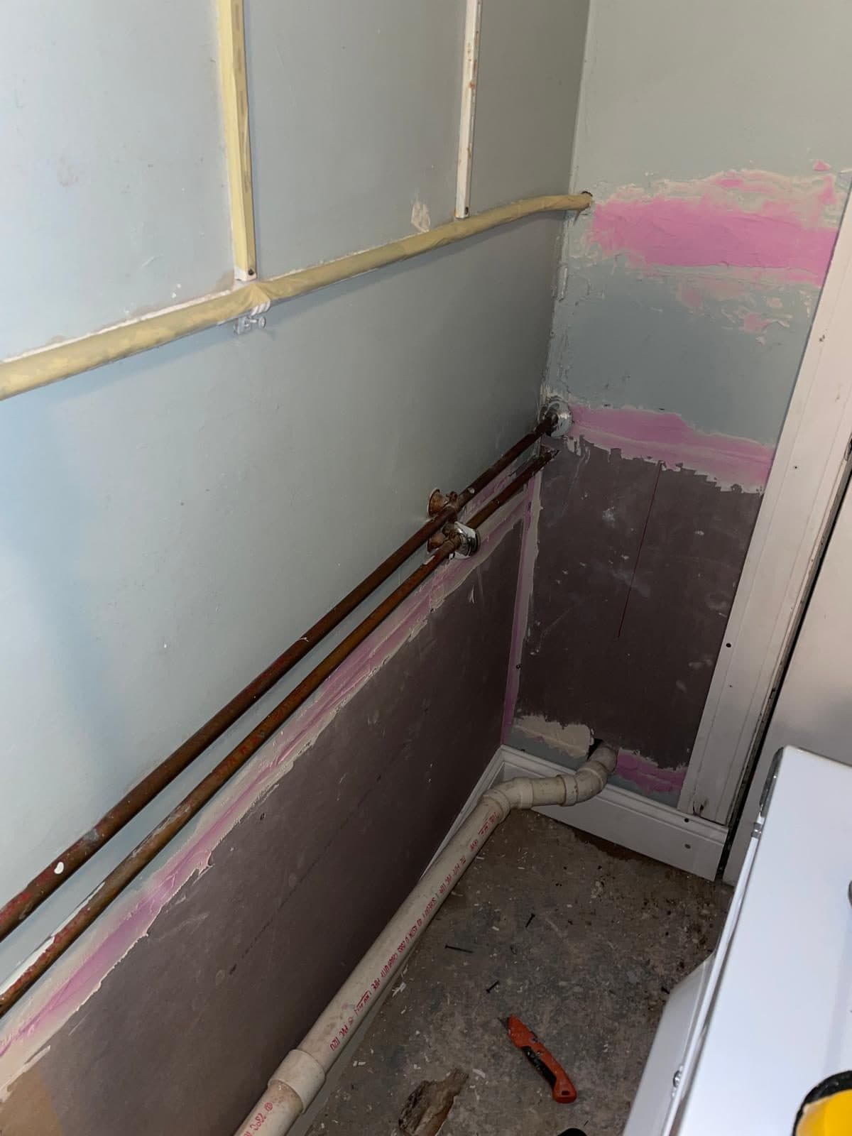 Wall repaired and refinished after plumbing work in a Boston home